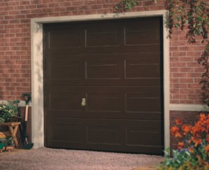 Garador Sectional Garage Door Georgian Woodgrain Design on house driveway