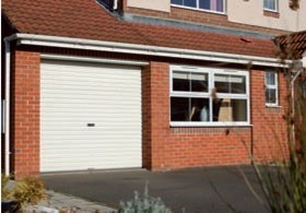 Gliderol Roller Shutter Garage Door installed on home in white