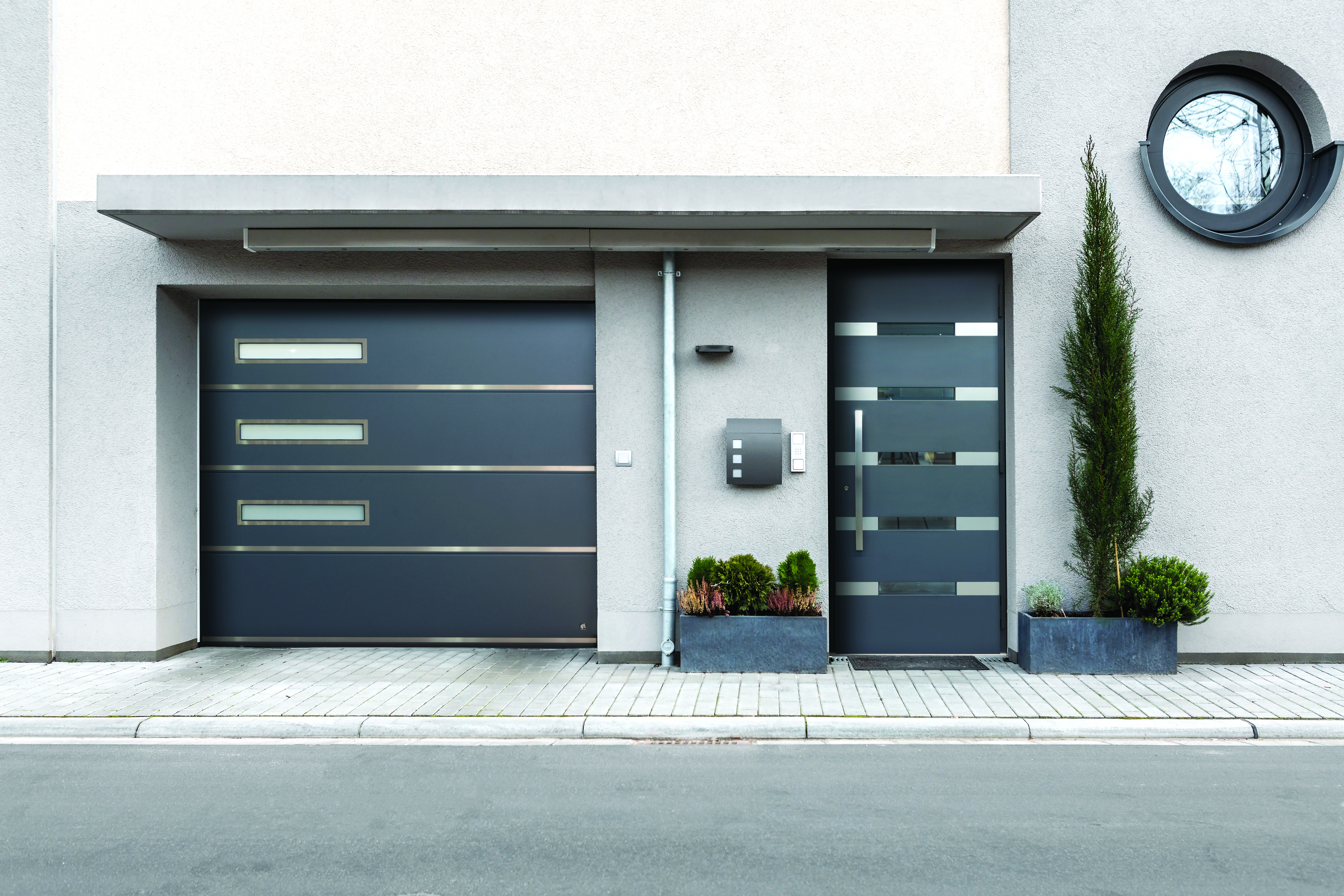 Designed garage doors matching with entrance doors